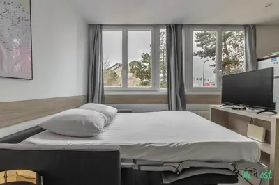 Un ou plusieurs lits dans un hébergement de l'établissement Appartement cosy pour 4 pers. – Parc des Expositions Porte de Versailles