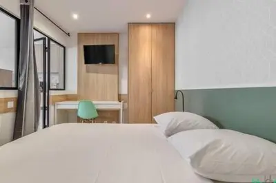 Un ou plusieurs lits dans un hébergement de l'établissement Logement ideal - Paris Expo P. de Versailles