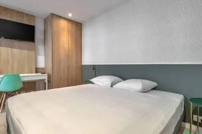 Un ou plusieurs lits dans un hébergement de l'établissement Logement ideal - Paris Expo P. de Versailles