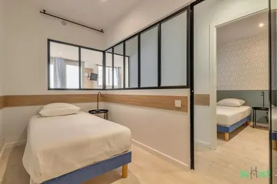 Un ou plusieurs lits dans un hébergement de l'établissement Apt cosy pour 6 - Paris Expo P. de Versailles