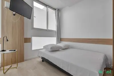 Un ou plusieurs lits dans un hébergement de l'établissement Apt cosy pour 6 - Paris Expo P. de Versailles