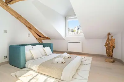 Un ou plusieurs lits dans un hébergement de l'établissement Le Marais - Prestige apartment for 3