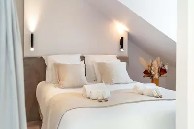 Un ou plusieurs lits dans un hébergement de l'établissement Le Marais - Prestige apartment for 3