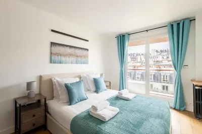 Un ou plusieurs lits dans un hébergement de l'établissement Stylish Stay - Balcony & Amazing View - Montmartre