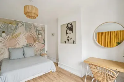 Un ou plusieurs lits dans un hébergement de l'établissement Beautiful apartment 10 minutes walk from the Eiffel Tower