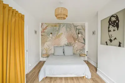 Un ou plusieurs lits dans un hébergement de l'établissement Beautiful apartment 10 minutes walk from the Eiffel Tower