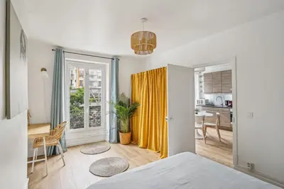 Un ou plusieurs lits dans un hébergement de l'établissement Beautiful apartment 10 minutes walk from the Eiffel Tower