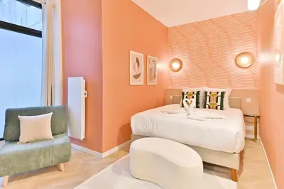 Un ou plusieurs lits dans un hébergement de l'établissement Élégant loft avec 2 chambres au cœur de Paris