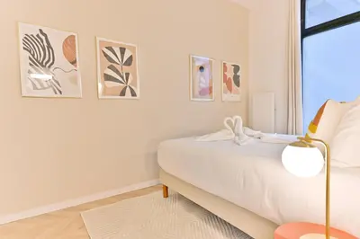 Un ou plusieurs lits dans un hébergement de l'établissement Élégant loft avec 2 chambres au cœur de Paris