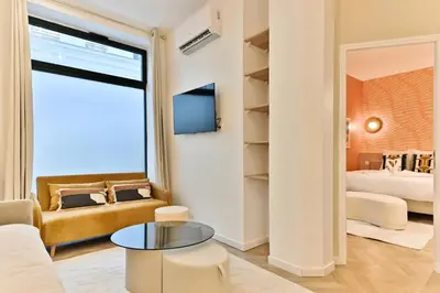 Un ou plusieurs lits dans un hébergement de l'établissement Élégant loft avec 2 chambres au cœur de Paris