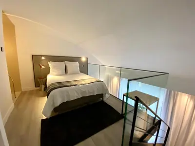 Un ou plusieurs lits dans un hébergement de l'établissement B0 Mini Loft Duplex 175Blo-Paris Convention
