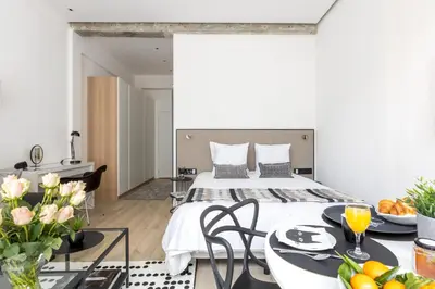 Un ou plusieurs lits dans un hébergement de l'établissement A4 Suite Studio 175Blo-Paris Convention