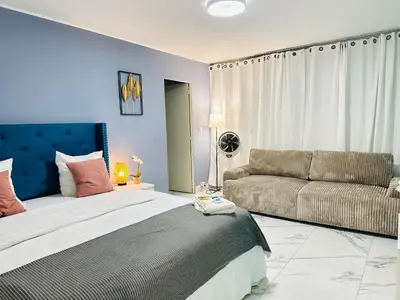 Coin salon dans l'établissement Holiday Apartment 01