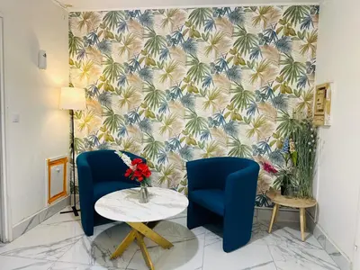 Coin salon dans l'établissement Holiday Apartment 01