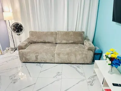 Coin salon dans l'établissement Holiday Apartment 01