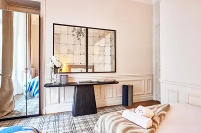 Un ou plusieurs lits dans un hébergement de l'établissement Chic Haussmann Apartment
