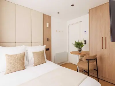 Un ou plusieurs lits dans un hébergement de l'établissement Elegant Studio 2P Montorgueil Grands Boulevards