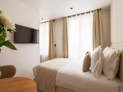 Un ou plusieurs lits dans un hébergement de l'établissement Elegant Studio 2P Montorgueil Grands Boulevards