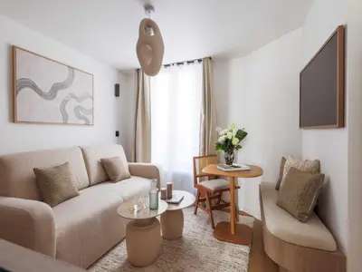 Coin salon dans l'établissement Chic and cosy apartment - 1BR- 4P- Bourse