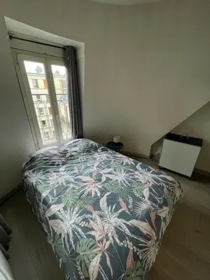 Un ou plusieurs lits dans un hébergement de l'établissement Eiffel Apartment