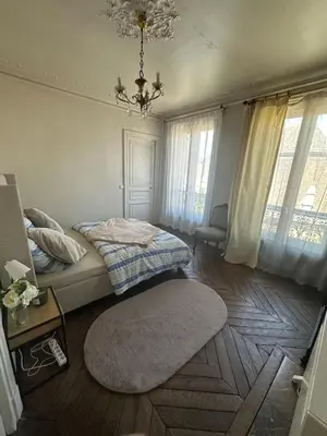 Un ou plusieurs lits dans un hébergement de l'établissement Appartement de charme 3 pièces Paris Centre Marais