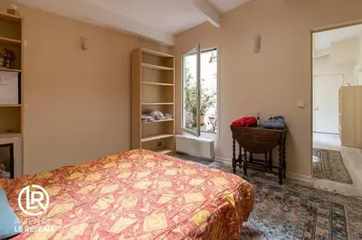 Un ou plusieurs lits dans un hébergement de l'établissement Appartement lumineux Panthéon