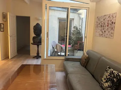 Coin salon dans l'établissement Appartement lumineux Panthéon