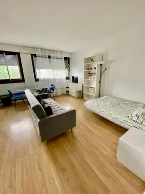 Un ou plusieurs lits dans un hébergement de l'établissement Studio Leblanc Porte de Versailles