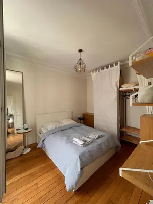 Un ou plusieurs lits dans un hébergement de l'établissement Appartement Cœur Passy