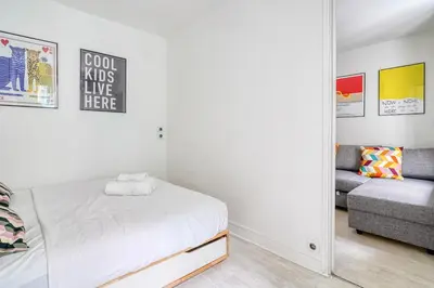 Un ou plusieurs lits dans un hébergement de l'établissement Cozy Apartment 4people - Canal St Martin & République