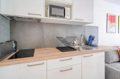 Cuisine ou kitchenette dans l'établissement Cozy Apartment 4people - Canal St Martin & République