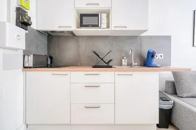 Cuisine ou kitchenette dans l'établissement Cozy Apartment 4people - Canal St Martin & République