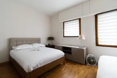 Un ou plusieurs lits dans un hébergement de l'établissement 2-Person Apartment Near Beaugrenelle - III