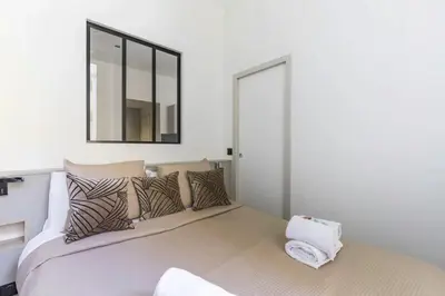 Un ou plusieurs lits dans un hébergement de l'établissement Appartement de Charme Opera Saint Honore