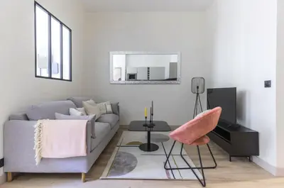 Coin salon dans l'établissement Appartement de Charme Opera Saint Honore