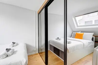 Un ou plusieurs lits dans un hébergement de l'établissement Stylish Nest - Heart of Paris