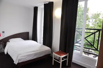 Un ou plusieurs lits dans un hébergement de l'établissement Hotel de la Tour