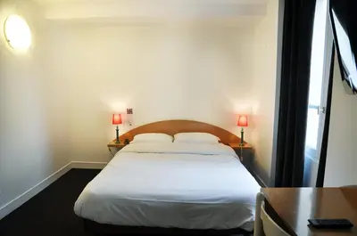 Un ou plusieurs lits dans un hébergement de l'établissement Hotel de la Tour