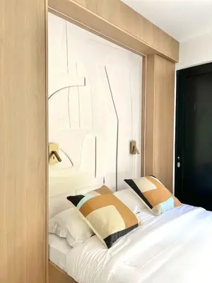 Un ou plusieurs lits dans un hébergement de l'établissement Marais Paris - Appartement familial avec 3 chambres et balcon