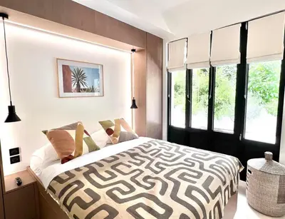 Un ou plusieurs lits dans un hébergement de l'établissement Marais Paris - Appartement familial avec 3 chambres et balcon