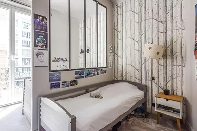 Un ou plusieurs lits dans un hébergement de l'établissement Appartement chic près de l'Arc de Triomphe