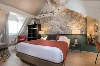 Un ou plusieurs lits dans un hébergement de l'établissement Hôtel Jeanne d'Arc Le Marais