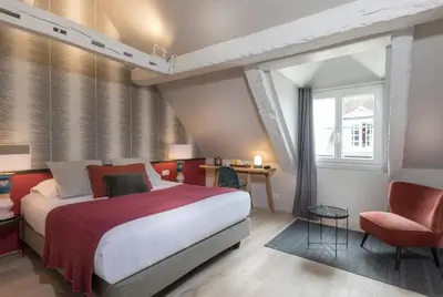 Un ou plusieurs lits dans un hébergement de l'établissement Hôtel Jeanne d'Arc Le Marais