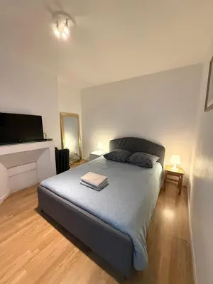 Un ou plusieurs lits dans un hébergement de l'établissement Appartement Rodier Montmartre Paris