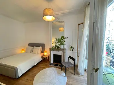 Un ou plusieurs lits dans un hébergement de l'établissement Magnific appartment near Arc de Triomphe