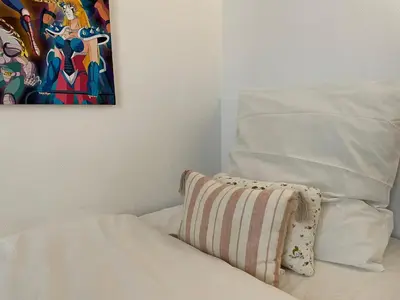 Un ou plusieurs lits dans un hébergement de l'établissement Magnific appartment near Arc de Triomphe