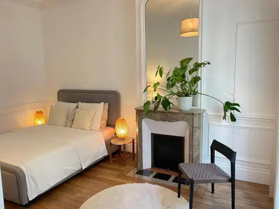 Un ou plusieurs lits dans un hébergement de l'établissement Magnific appartment near Arc de Triomphe