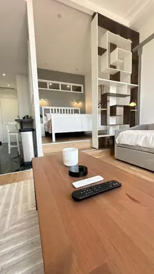 Un ou plusieurs lits dans un hébergement de l'établissement Suite luxueuse Avenue des Champs-Élysées