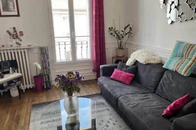 Coin salon dans l'établissement Cozy apartment of 35 m2 at the gates of Paris