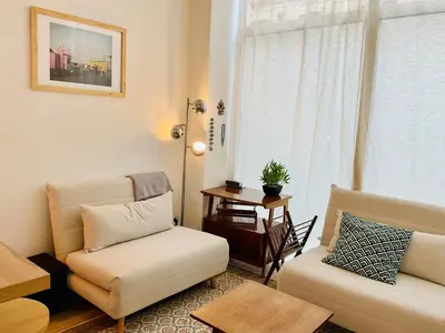 Coin salon dans l'établissement Appartement cosy et familial Paris